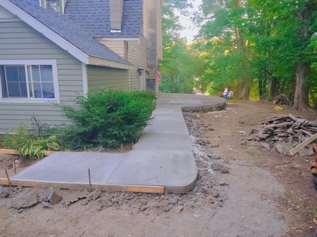 concrete pad behind a norwich ny home